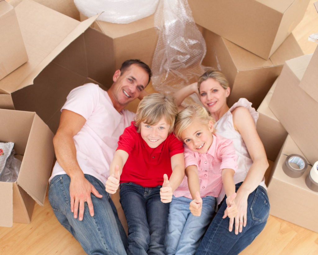 Family of four with boxes