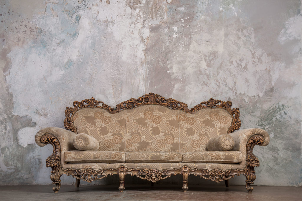 Antique couch against wall