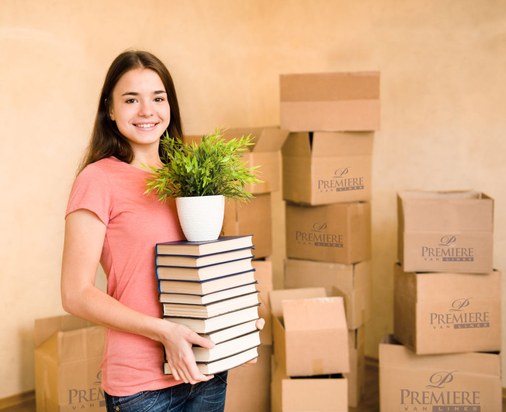 Girl standing in front of boxes
